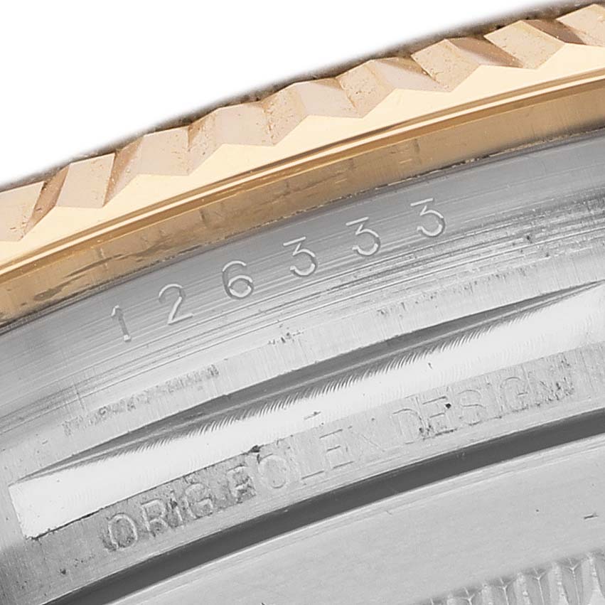 The image shows a close-up of the bezel and case edge of a Rolex Datejust 41 126333 Men's Steel and Gold (two tone) Champagne Dial, highlighting its model number and "Rolex Design" engraving.