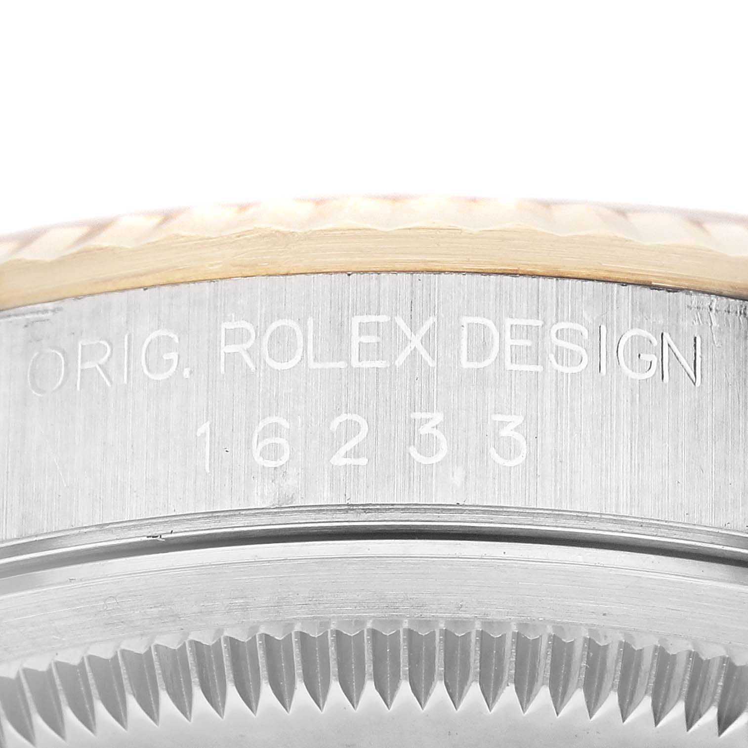 The image shows a close-up of the bezel and engraved model number of a Rolex Datejust 16233 Men's Steel and Gold (two tone) Champagne Dial 16233 Men's Steel and Gold (two tone) Champagne Dial watch.