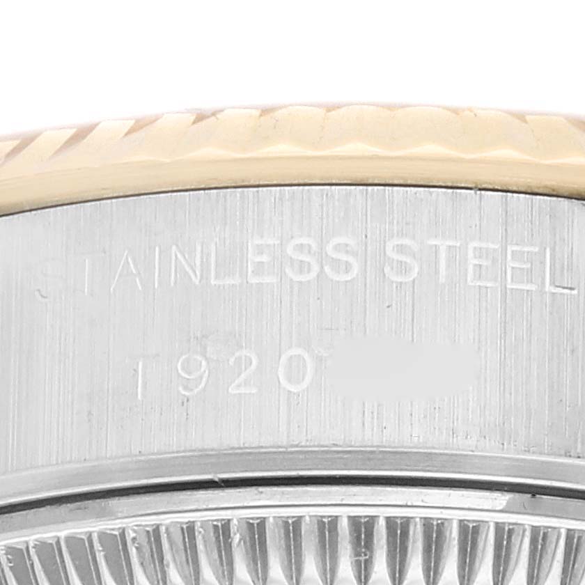 The image shows a close-up of the side of a Rolex Datejust 69173 Women's Steel and Gold (two tone) Champagne Dial 69173 Women's Steel and Gold (two tone) Champagne Dial watch, highlighting the steel casing and part of the fluted bezel.