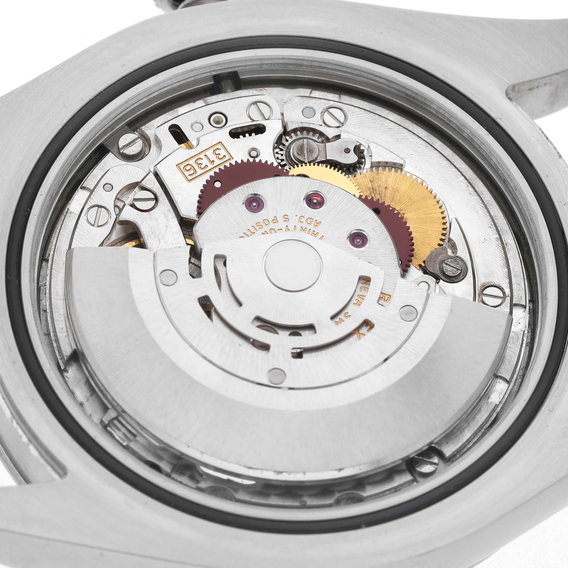 The image shows the back view of a Rolex Datejust 41 116300 Men's Stainless Steel Silver Dial, revealing its intricate movement and internal components.