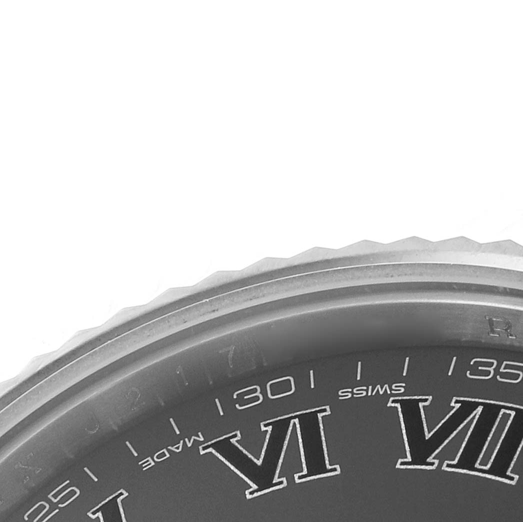 The image shows a close-up of the dial and bezel edge of a Rolex Datejust 41 116334 Men's Stainless Steel Black Dial, focusing on the Roman numerals and minute markers.