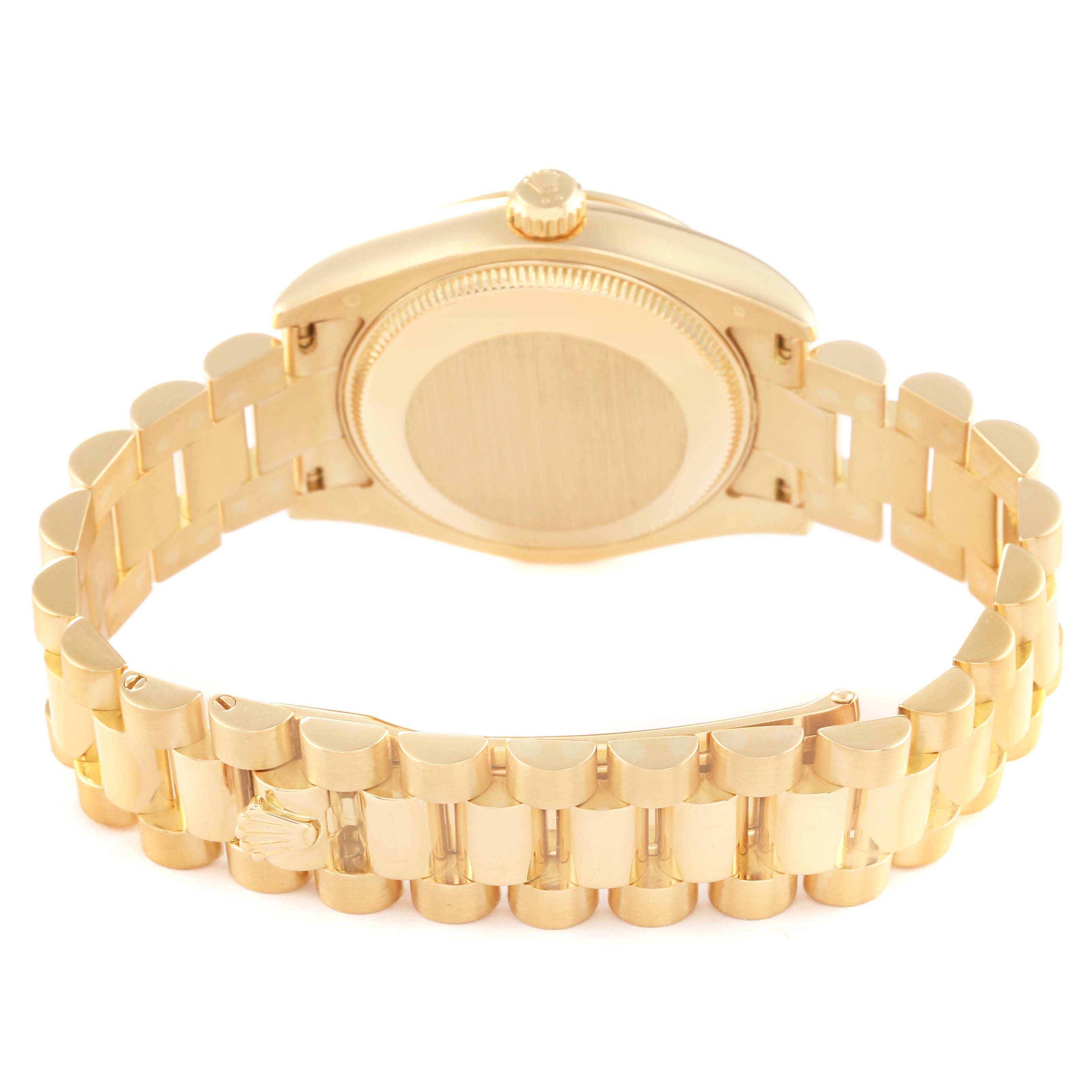 This image shows the case back and the bracelet of a Rolex President 178278 Women
s Yellow Gold Black Dial 178278 Women
s Yellow Gold Black Dial model watch from a rear angle.