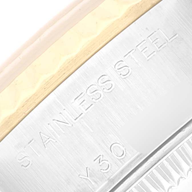 This image shows a close-up of the outer edge of the case back for a Rolex Datejust 79173 Women's Steel and Gold (two tone) Silver Dial 79173 Women's Steel and Gold (two tone) Silver Dial watch, featuring the "Stainless Steel" engraving.