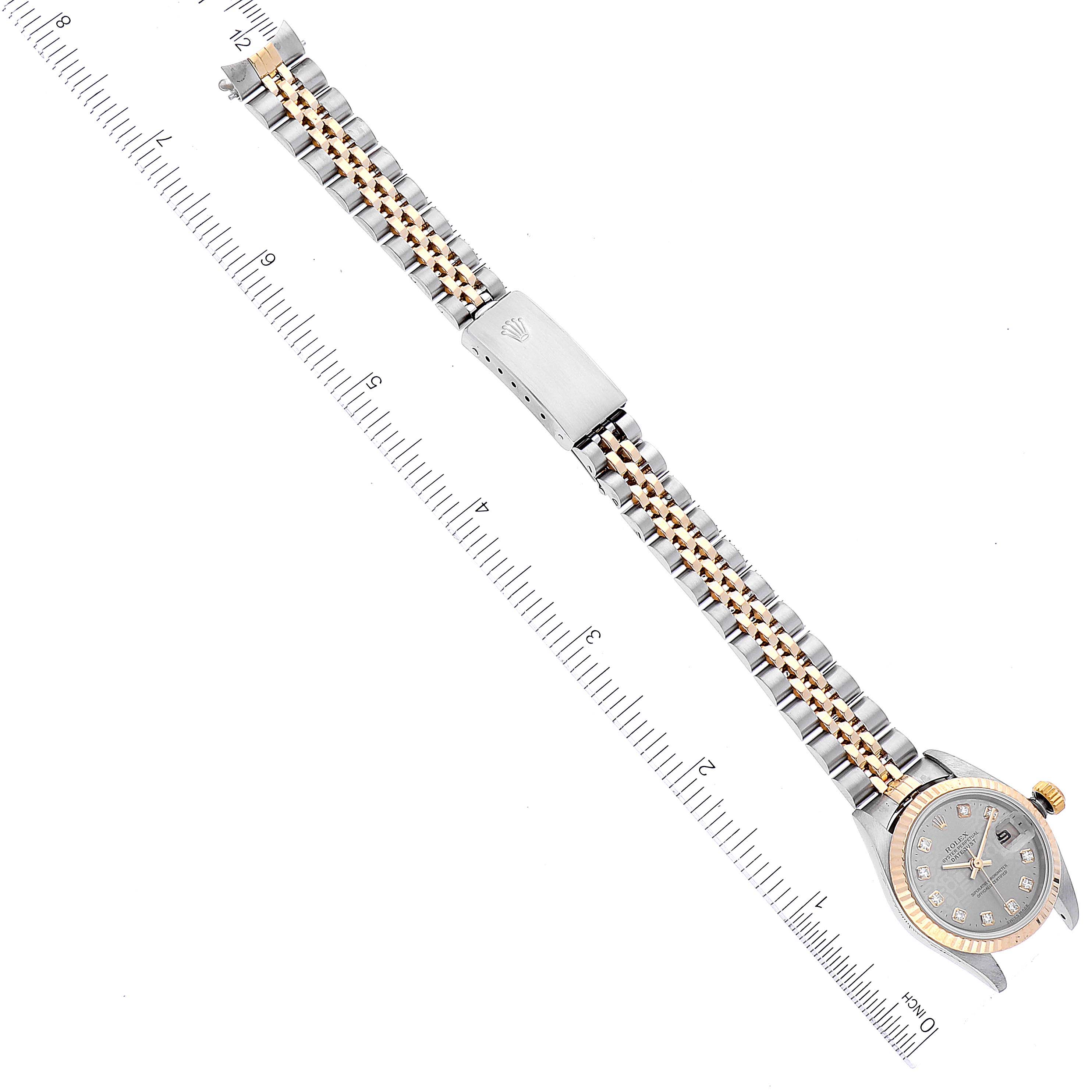 The image shows a top-down view of a Rolex Datejust 79173 Women's Steel and Gold (two tone) Silver Dial 79173 Women's Steel and Gold (two tone) Silver Dial watch, displaying its bracelet, clasp, and case.
