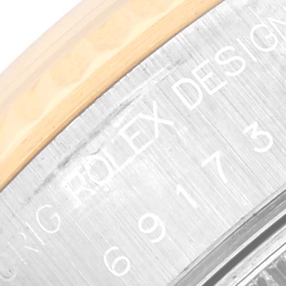 The image shows a close-up view of the case back of a Rolex Datejust 69173 Women's Steel and Gold (two tone) Black Dial 69173 Women's Steel and Gold (two tone) Black Dial watch, focusing on the engraved text.