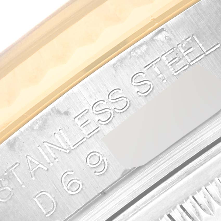 The image shows a close-up of the serial engraving on the stainless steel case of the Rolex Datejust 116233 Men's Steel and Gold (two tone) Blue Dial.