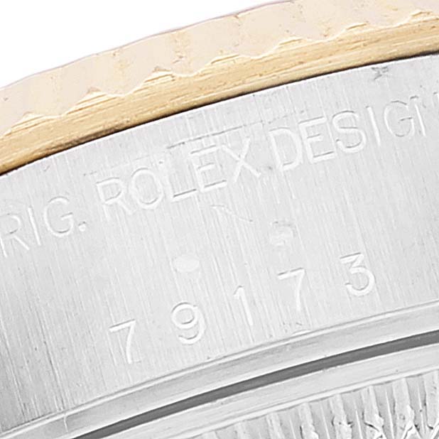 The image shows a close-up angle of the bezel and side engraved with model number "79173" of the Rolex Datejust 79173 Women's Steel and Gold (two tone) Champagne Dial 79173 Women's Steel and Gold (two tone) Champagne Dial watch.