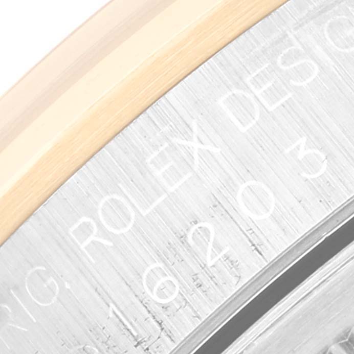 The image shows a close-up of the engraving and bezel on a Rolex Datejust 16203 Men's Steel and Gold (two tone) Grey Dial 16203 Men's Steel and Gold (two tone) Grey Dial watch.