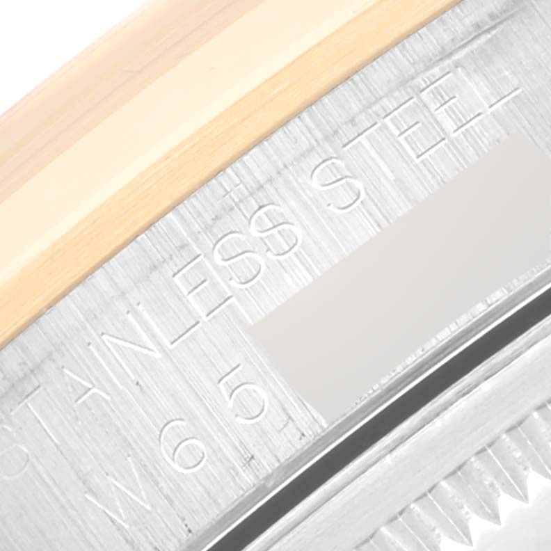 This close-up image shows the engraved case and bezel of a Rolex Datejust 16203 Men's Steel and Gold (two tone) Grey Dial 16203 Men's Steel and Gold (two tone) Grey Dial watch, highlighting the "STAINLESS STEEL" text.