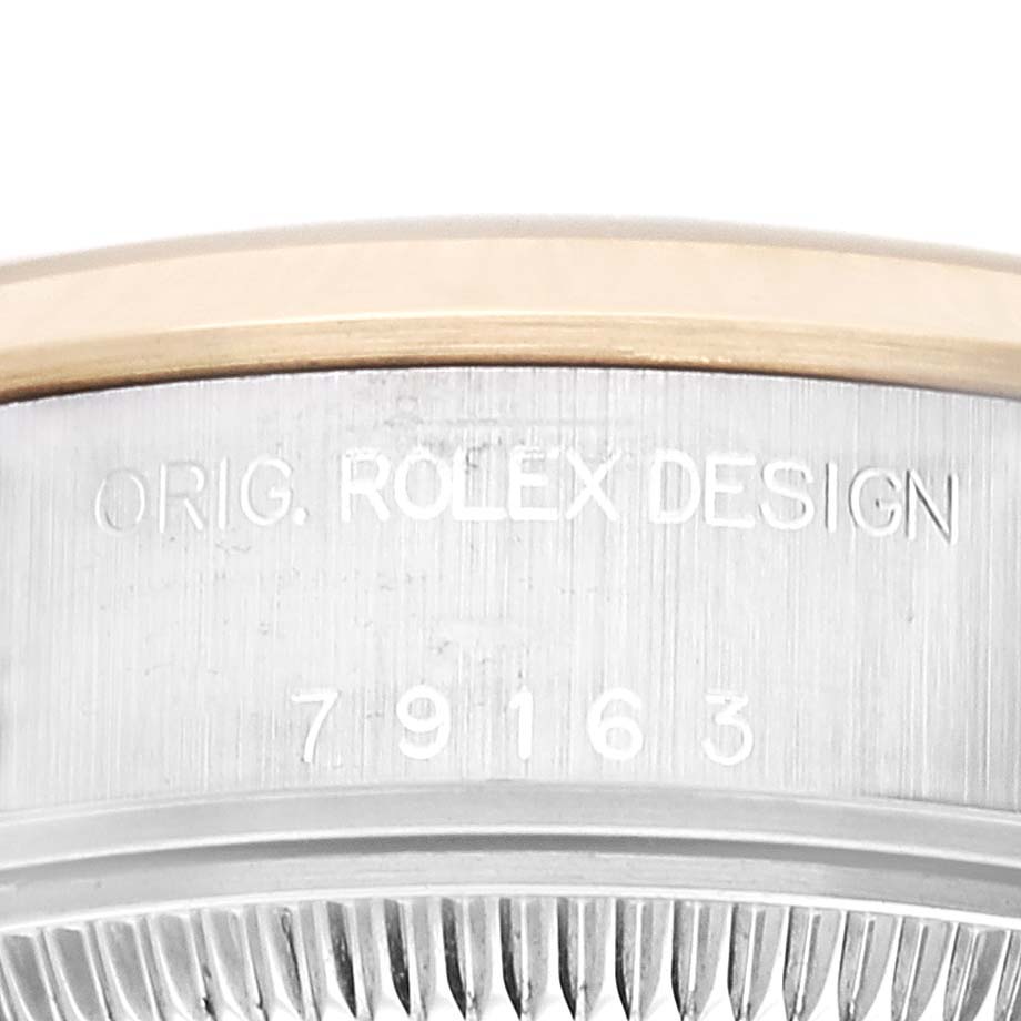 The image shows a close-up of the case side of the Rolex Datejust 79163 Women's Steel and Gold (two tone) Grey Dial 79163 Women's Steel and Gold (two tone) Grey Dial model, featuring the inscription "ORIG. ROLEX DESIGN" and model number "79163".