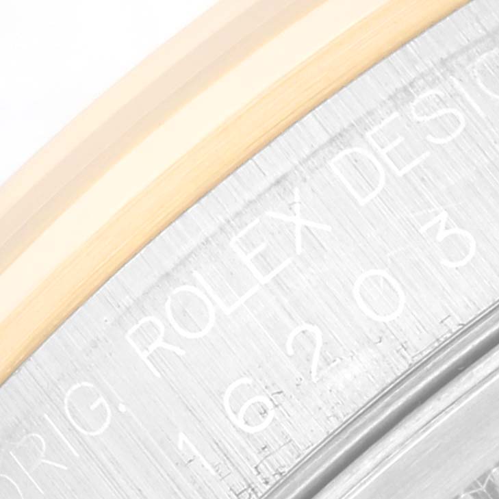 The image shows a close-up view of the outer rim and engraved text on the case back of a Rolex Datejust 16203 Men's Steel and Gold (two tone) White Dial 16203 Men's Steel and Gold (two tone) White Dial watch.