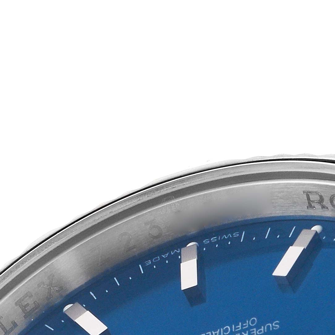 The image shows a close-up of the top portion of a Rolex Turn-o-Graph 116264 Men's Stainless Steel Blue Dial watch, highlighting the bezel and dial with visible markers.