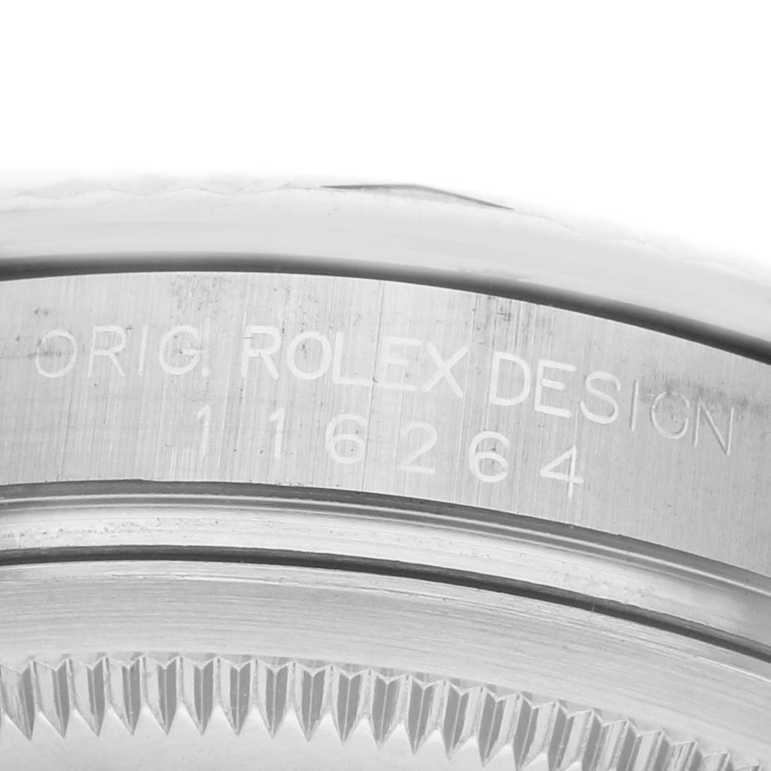 The image shows a close-up of the case edge with engravings on a Rolex Turn-o-Graph 116264 Men's Stainless Steel Blue Dial watch.