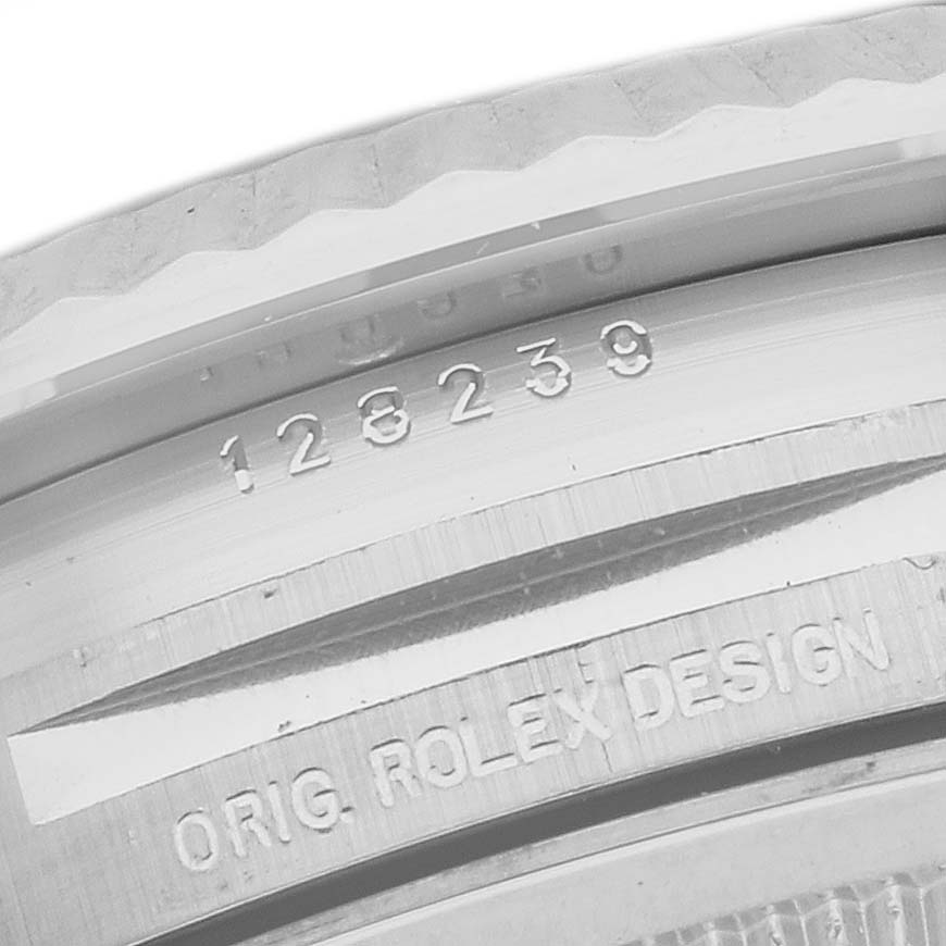 The image shows a close-up of the inner bezel of a Rolex President 128239 Men's White Gold White Dial, featuring engraving details.