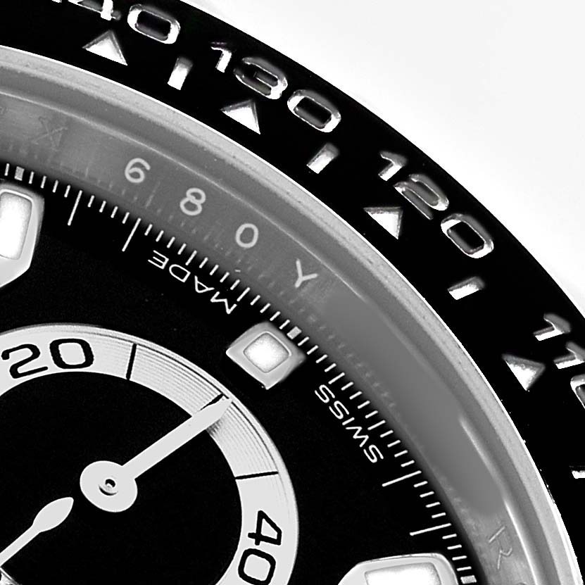 The image shows a close-up of the Rolex Daytona 116500LN Men's Stainless Steel Black Dial watch, focusing on the bezel and sub-dial from a side angle.