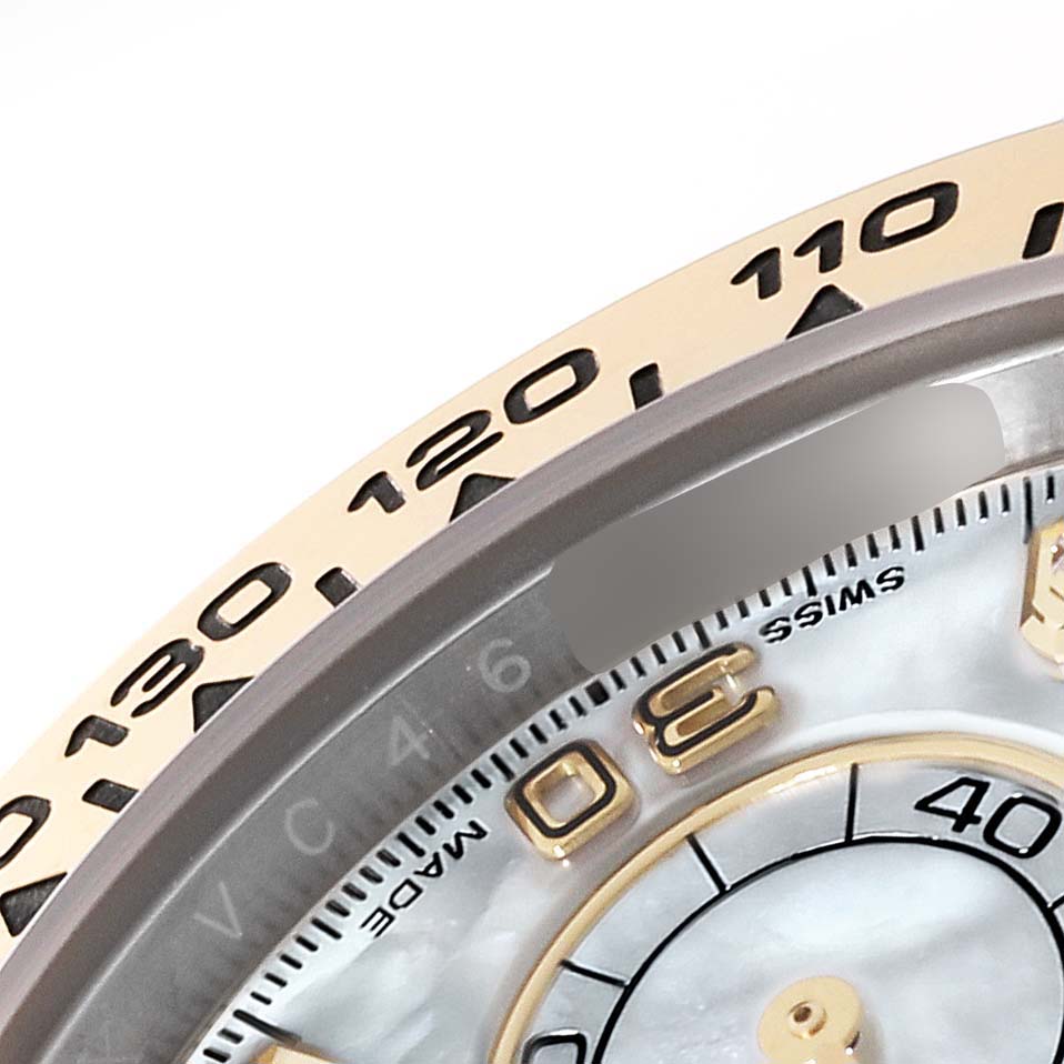 The image shows a close-up of the bezel and part of the dial of a Rolex Daytona 116503 Men's Steel and Gold (two tone) Mother of Pearl Dial 116503 Men's Steel and Gold (two tone) Mother of Pearl Dial watch, displaying numerals and markers.