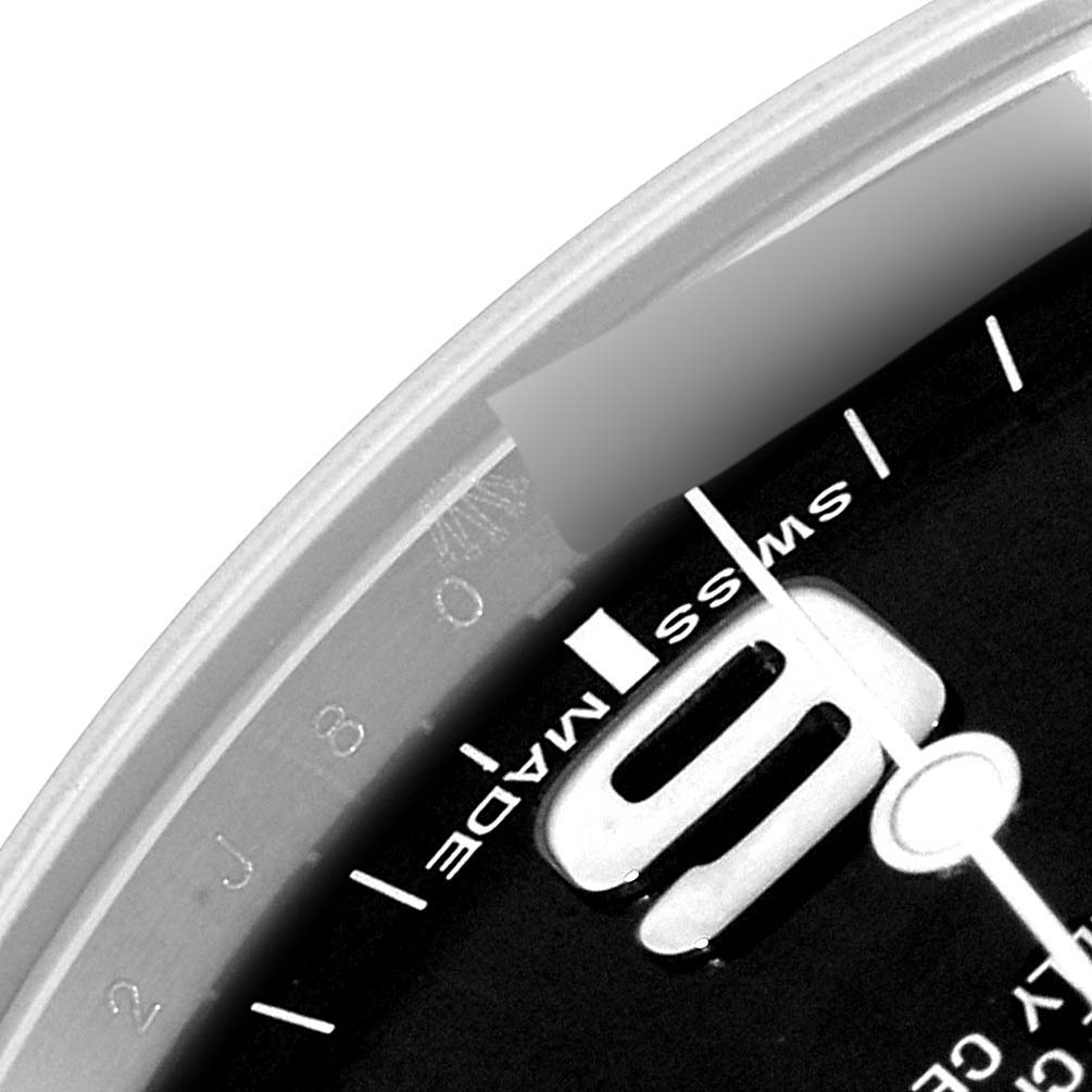 The image shows a close-up angle of the Rolex Explorer 214270 Men
s Stainless Steel Black Dial 214270 Men
s Stainless Steel Black Dial watch dial, highlighting the "Swiss Made" text near the 9 o
clock marker.