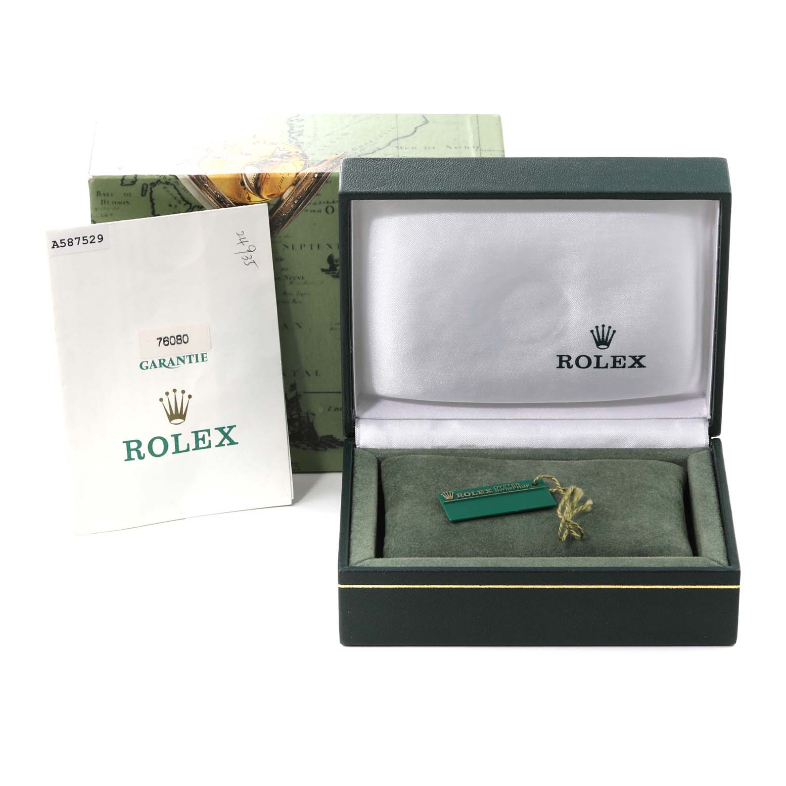 The image shows the packaging and accessories for the Rolex Oyster Perpetual 76080 Women's Stainless Steel Blue Dial 76080 Women's Stainless Steel Blue Dial model, including the box, pillow, and warranty booklet.