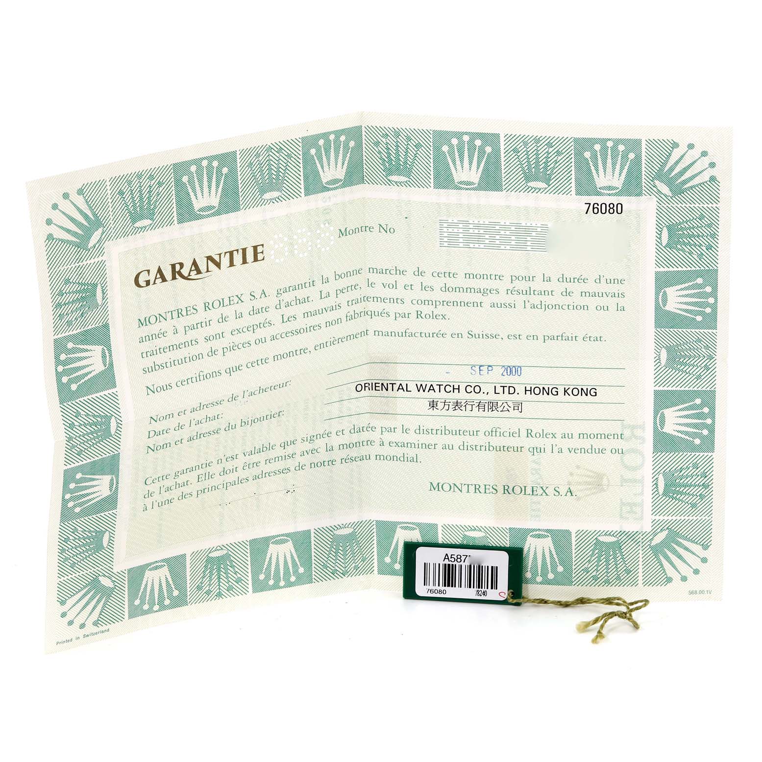 This image shows the guarantee and tag for a Rolex Oyster Perpetual 76080 Women's Stainless Steel Blue Dial 76080 Women's Stainless Steel Blue Dial watch.