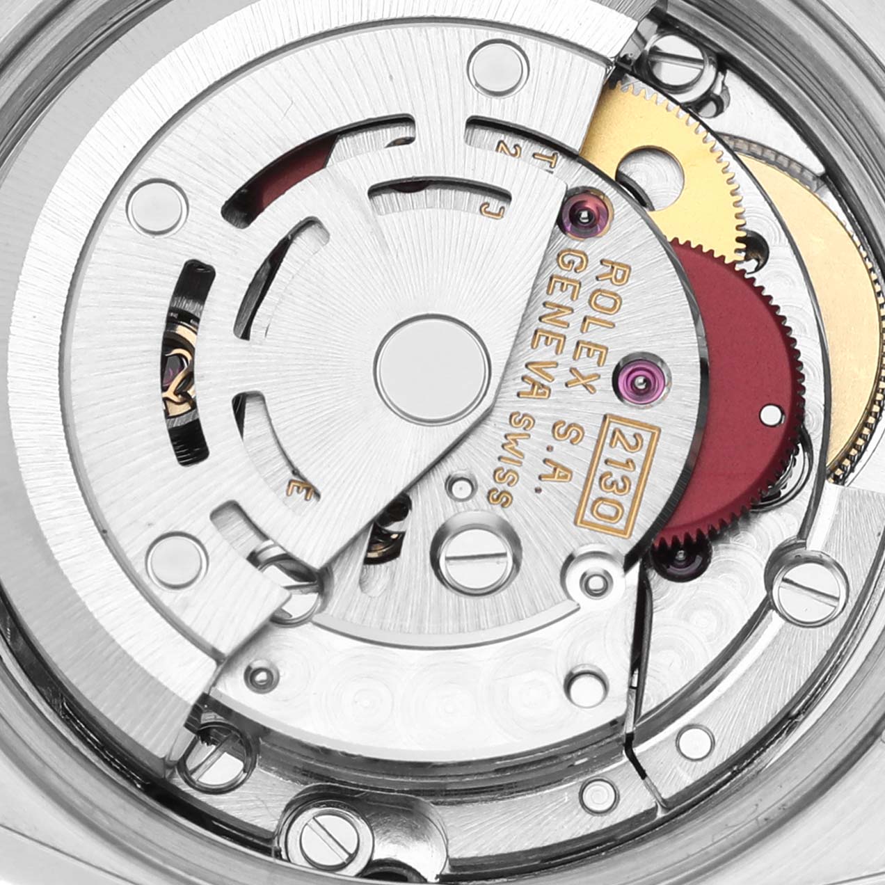 This close-up image shows the internal mechanism of a Rolex Oyster Perpetual 67193 Women's Steel and Gold (two tone) Black Dial 67193 Women's Steel and Gold (two tone) Black Dial watch, highlighting its intricate gears and movements.