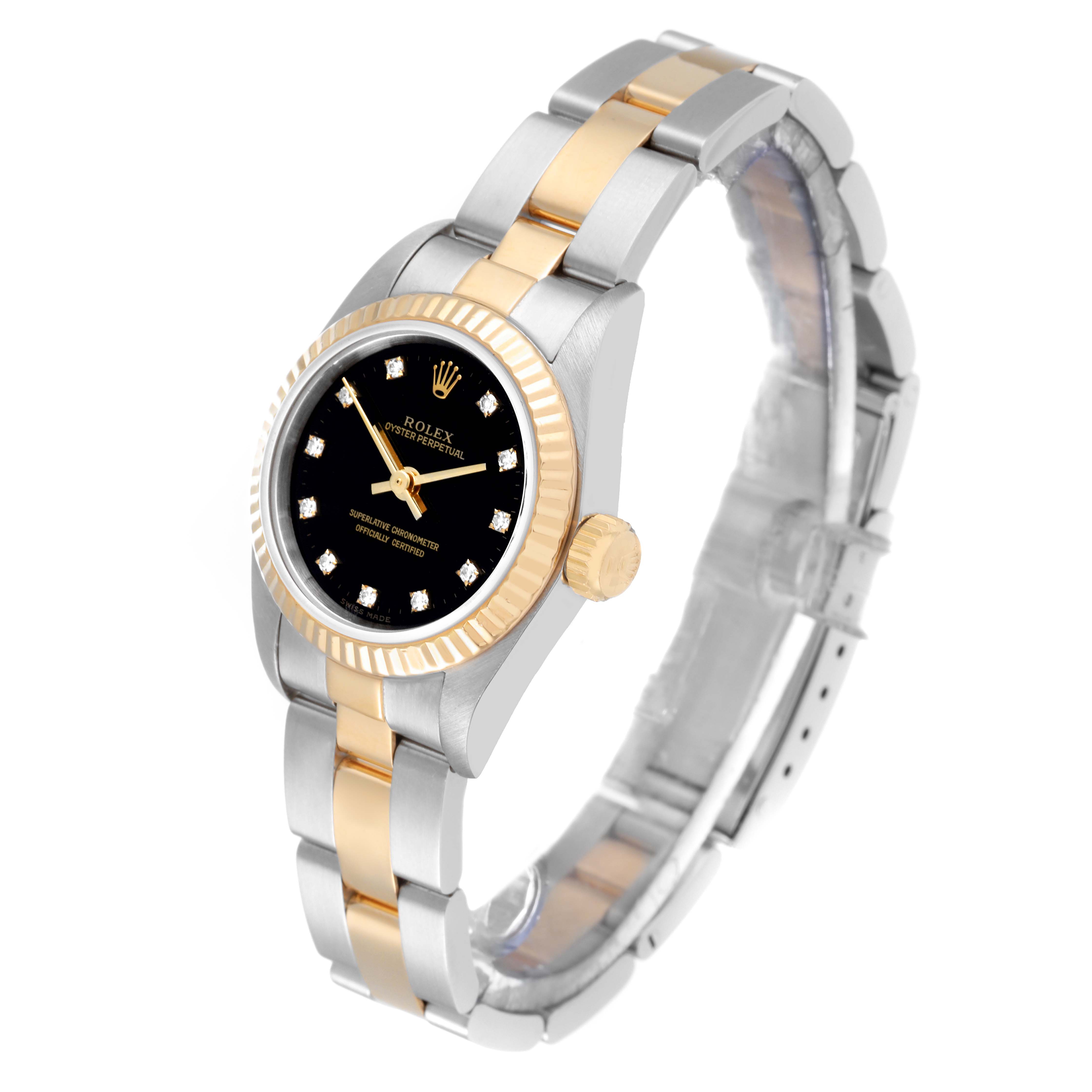 The image shows a Rolex Oyster Perpetual 67193 Women's Steel and Gold (two tone) Black Dial 67193 Women's Steel and Gold (two tone) Black Dial watch at an angle, highlighting the dial, crown, bezel, and two-tone bracelet.