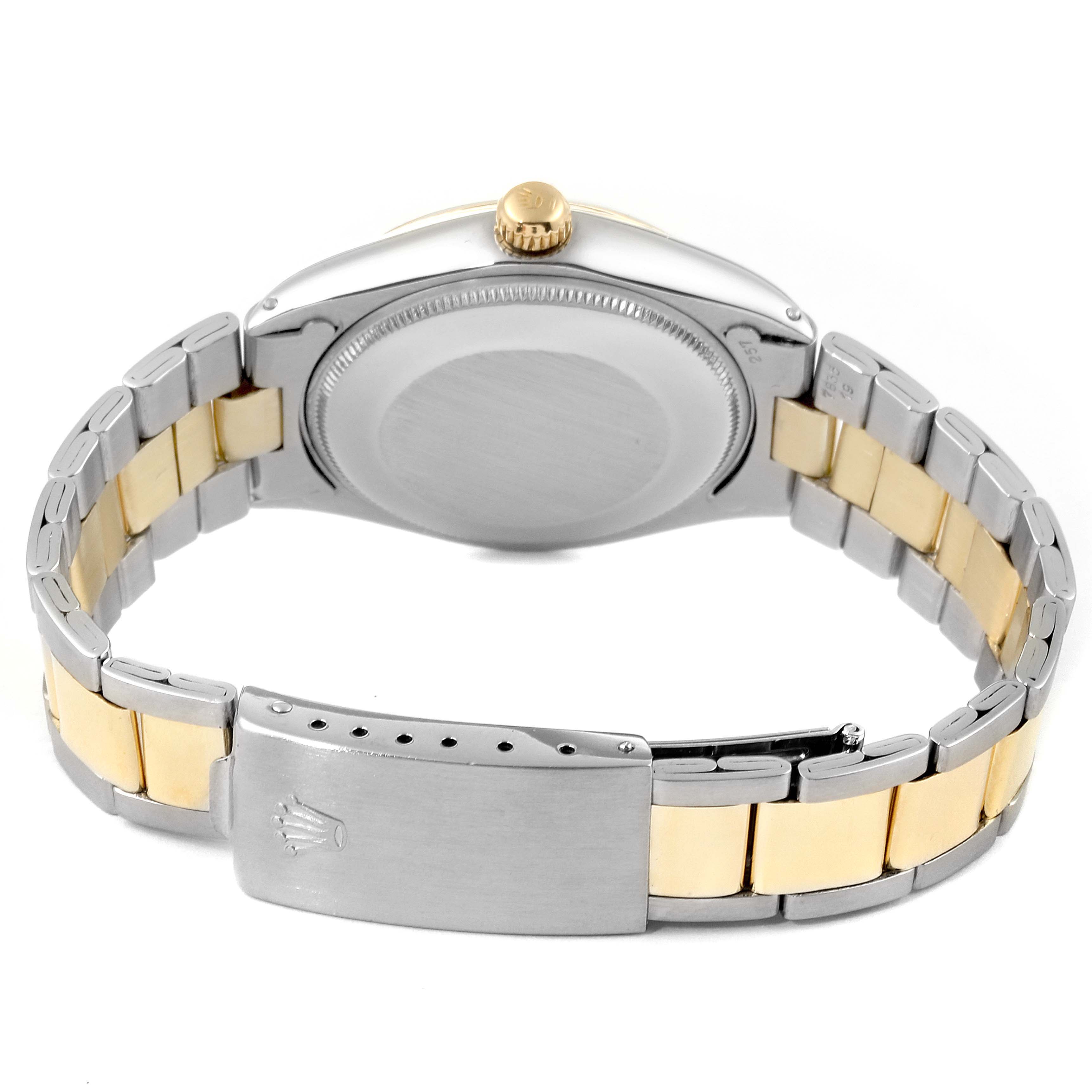 The image shows the back and bracelet of a Rolex Vintage Collection 1002 Men
s Steel and Gold (two tone) Champagne Dial 1002 Men
s Steel and Gold (two tone) Champagne Dial watch at a slight angle.
