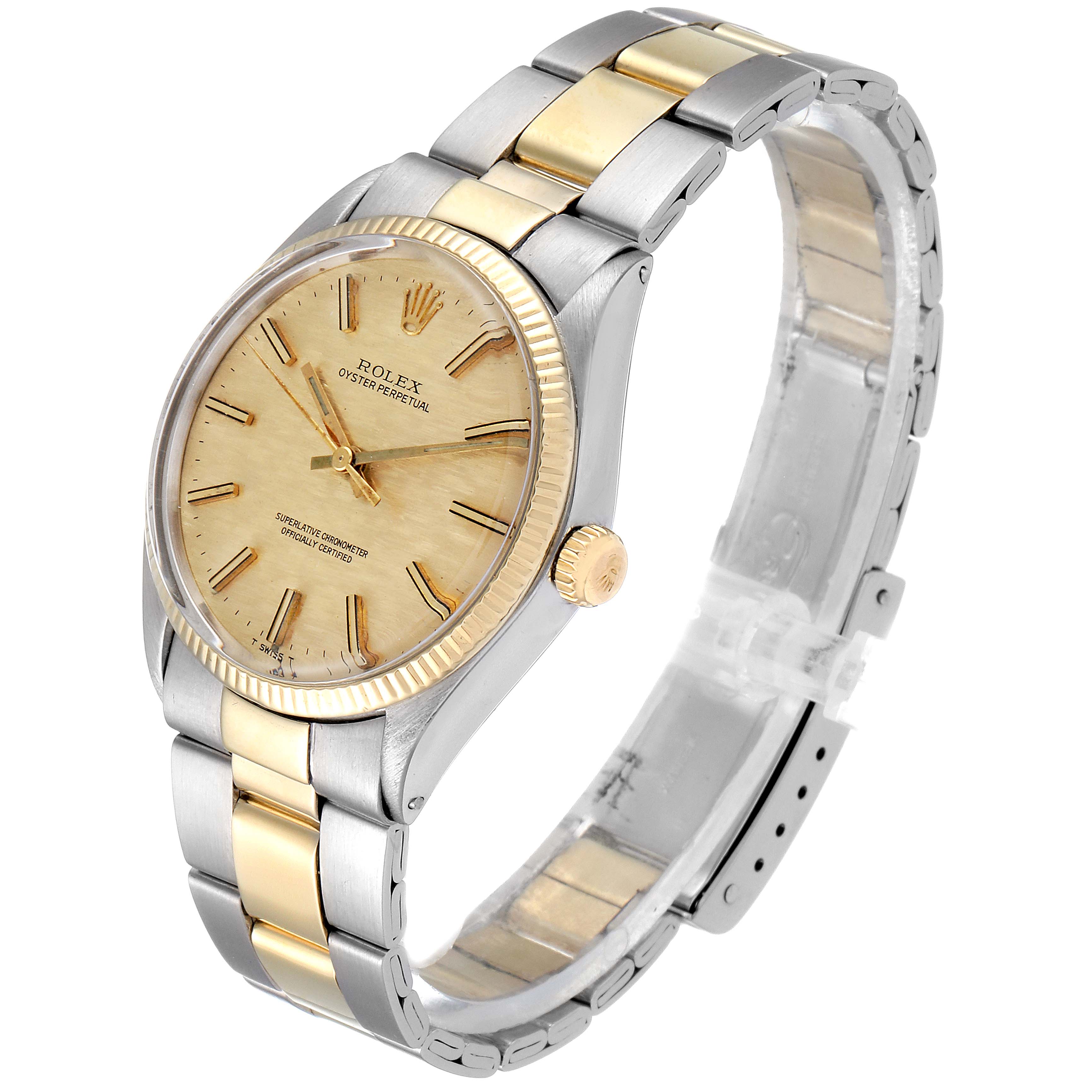 This Rolex Vintage Collection 1002 Men
s Steel and Gold (two tone) Champagne Dial 1002 Men
s Steel and Gold (two tone) Champagne Dial model is shown at a three-quarter angle, highlighting the face, bezel, crown, and two-tone bracelet.