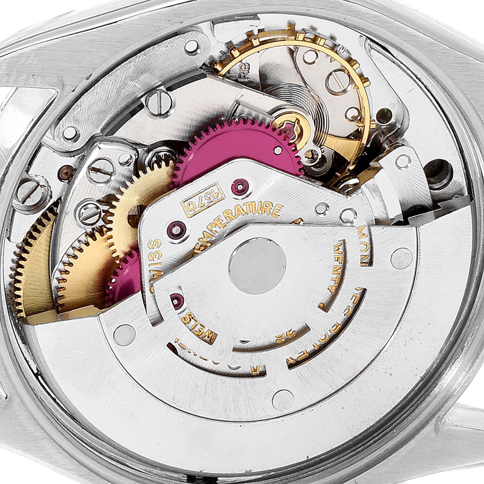 The image shows a close-up view of the internal mechanism of a Rolex Vintage Collection 1002 Men
s Steel and Gold (two tone) Champagne Dial 1002 Men
s Steel and Gold (two tone) Champagne Dial model watch.