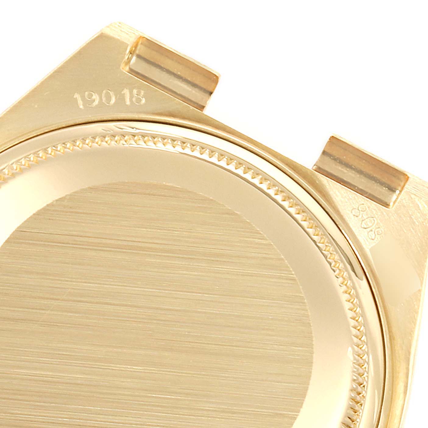 This image shows the back casing and lugs of a Rolex President 19018 Men
s Yellow Gold Black Dial 19018 Men
s Yellow Gold Black Dial model watch from an oblique angle.