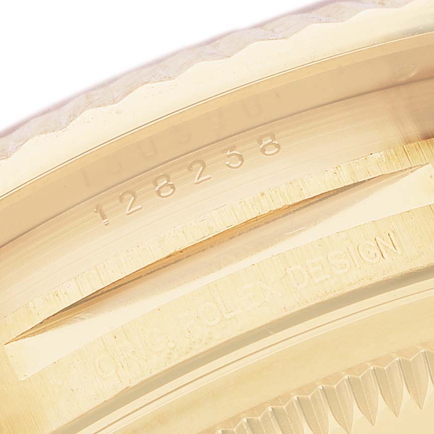 The image shows a close-up angle of the case edge and bezel underside of the Rolex President 128238 Men's Yellow Gold Mother of Pearl Dial model, highlighting engravings.