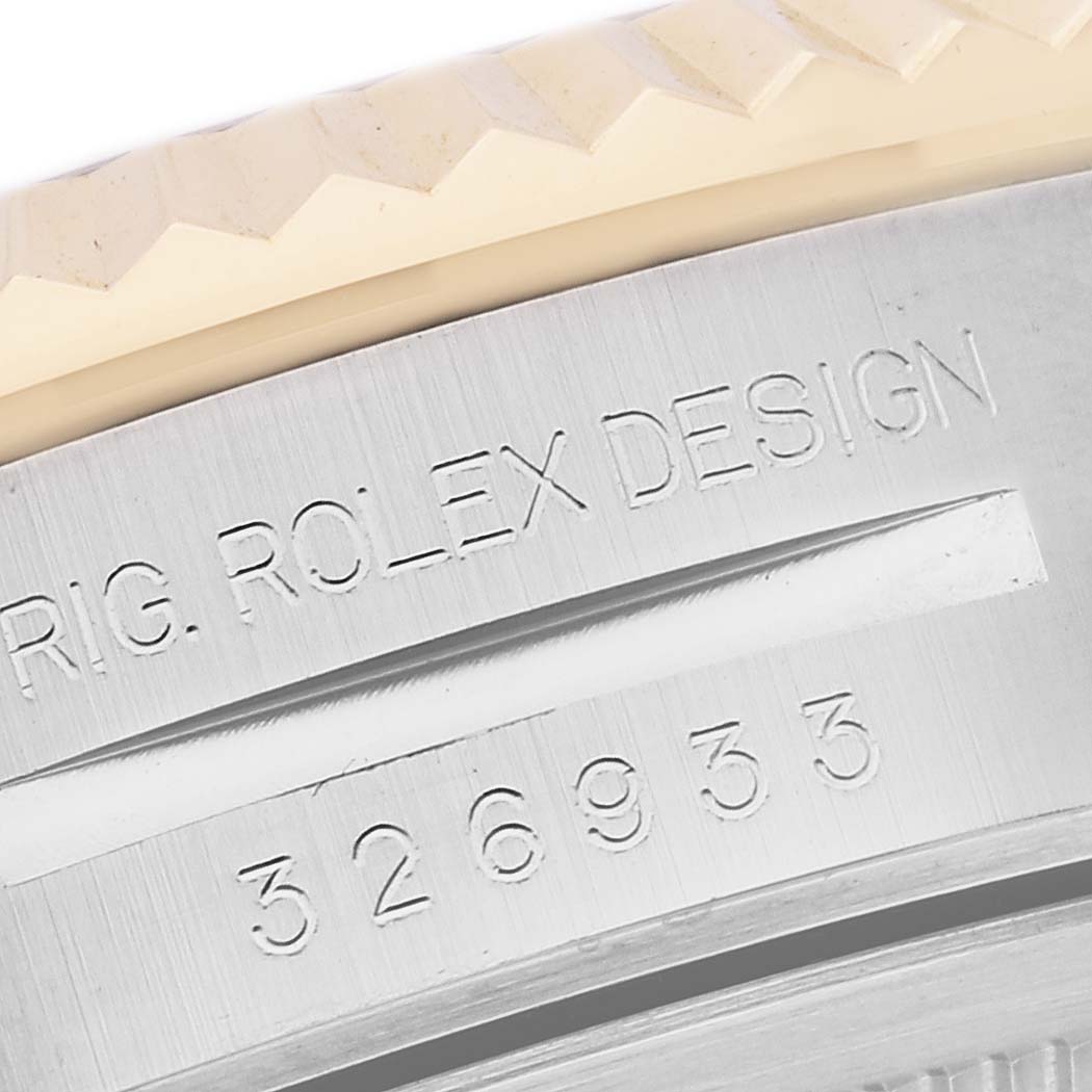 This is a close-up image of the Rolex Sky-Dweller 326933 Men's Steel and Gold (two tone) White Dial 326933 Men's Steel and Gold (two tone) White Dial showcasing its engraved model number "326933" and "ROLEX DESIGN."