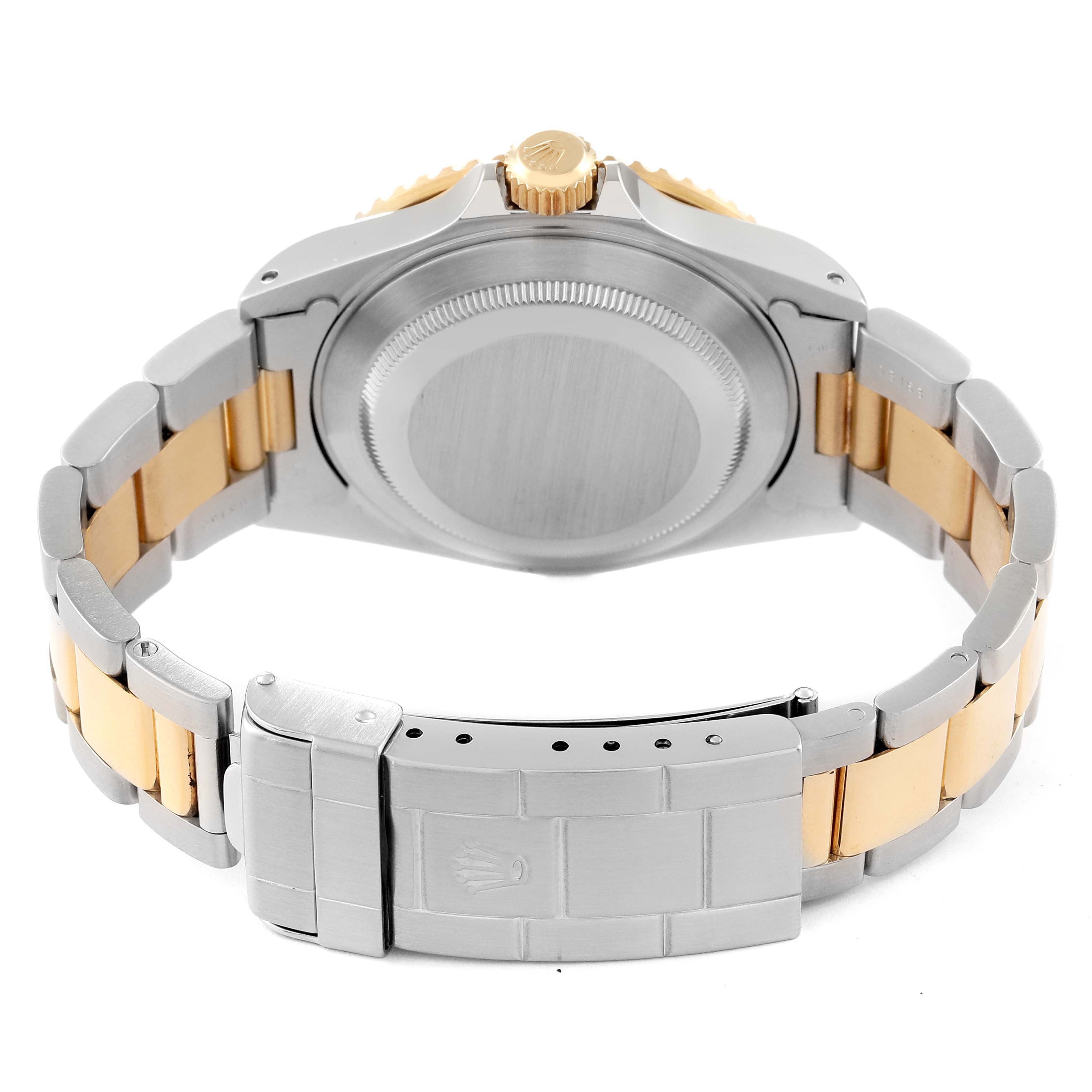 The image shows the back of a Rolex Submariner 16613 Men's Steel and Gold (two tone) Blue Dial 16613 Men's Steel and Gold (two tone) Blue Dial watch, highlighting the case back, crown, and two-tone bracelet with the clasp.