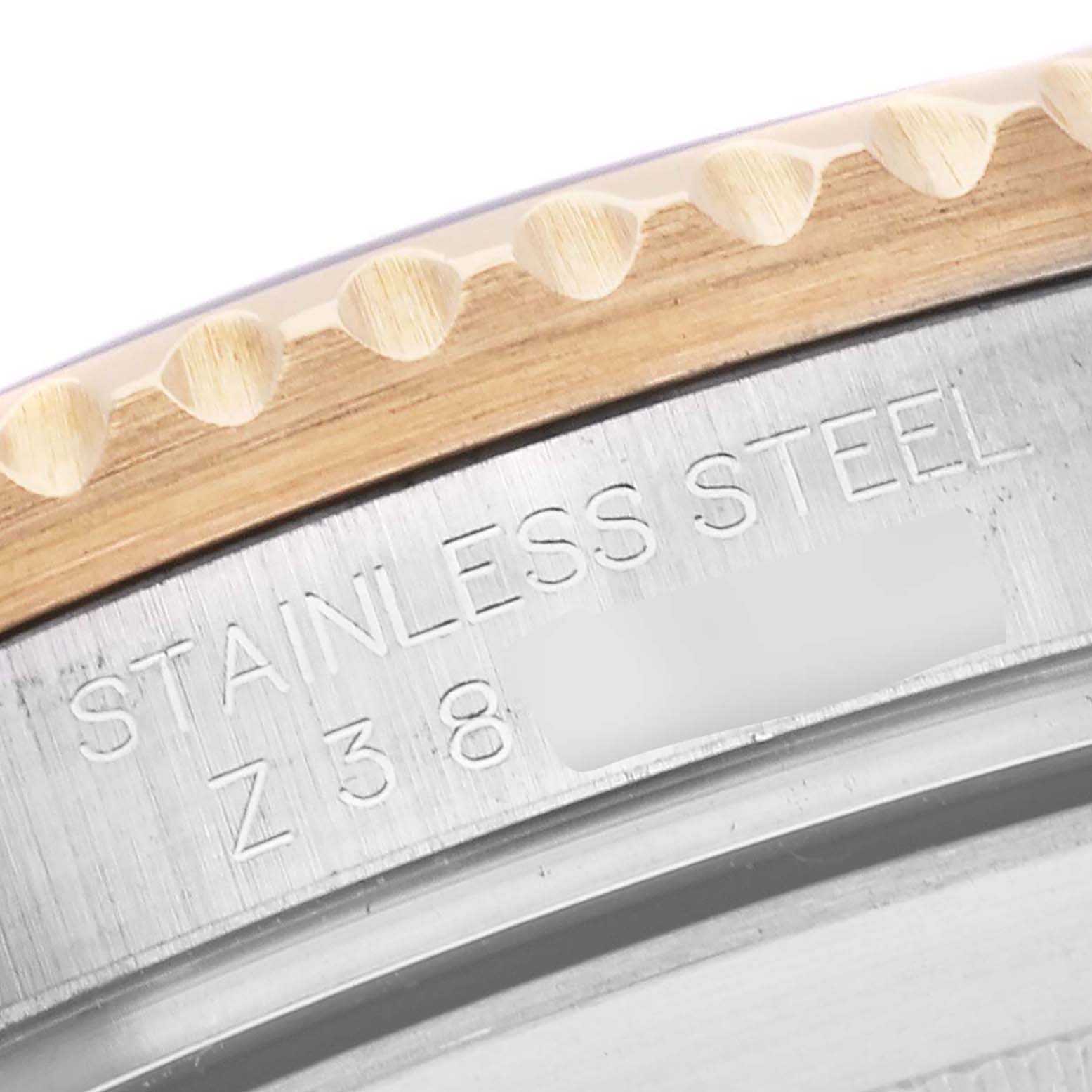 This close-up image shows the engraved stainless steel case and the bezel edge of a Rolex Submariner 16613 Men
s Steel and Gold (two tone) Blue Dial 16613 Men
s Steel and Gold (two tone) Blue Dial watch.