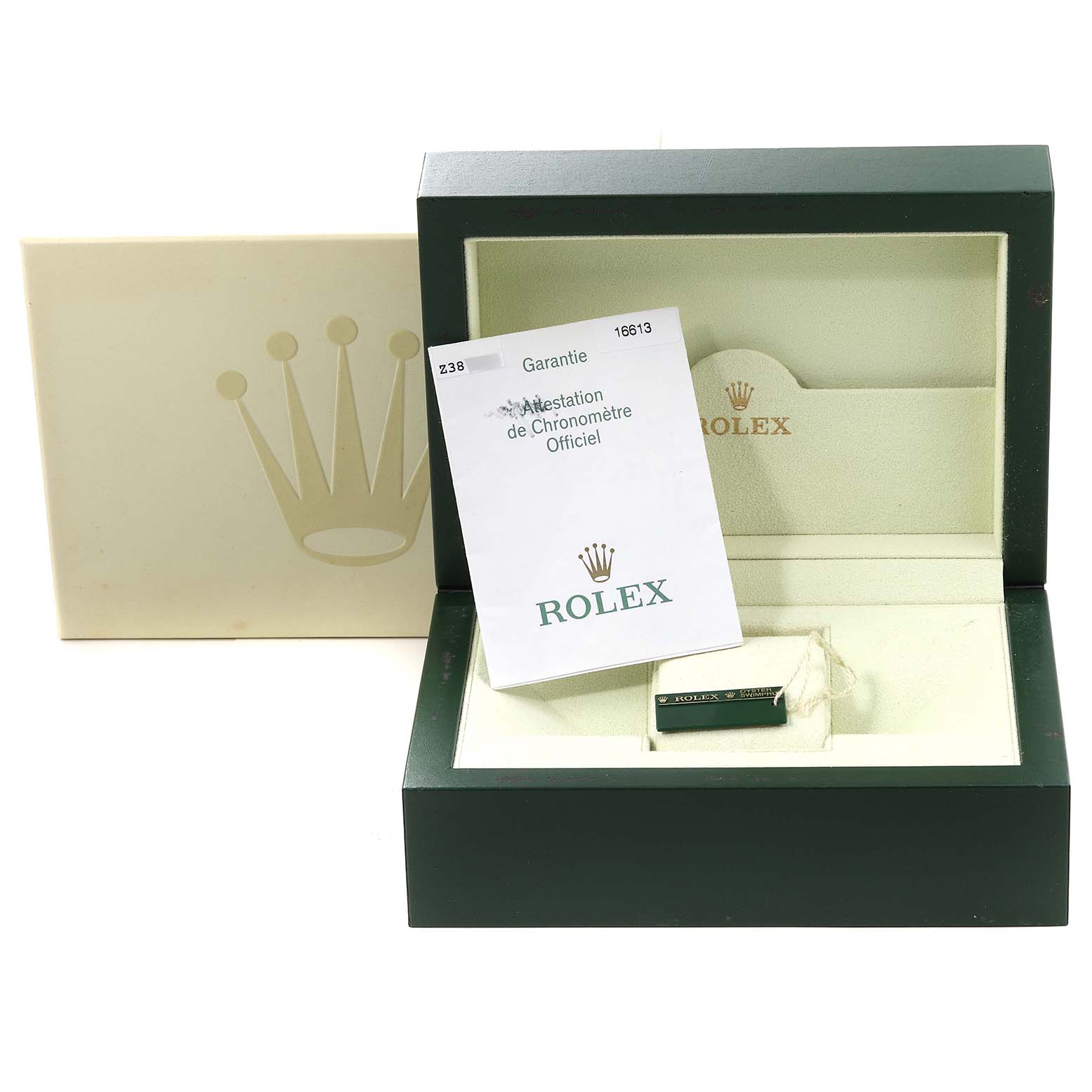 The image shows the open box of a Rolex Submariner 16613 Men
s Steel and Gold (two tone) Blue Dial 16613 Men
s Steel and Gold (two tone) Blue Dial watch, along with the warranty card and official certification booklet.
