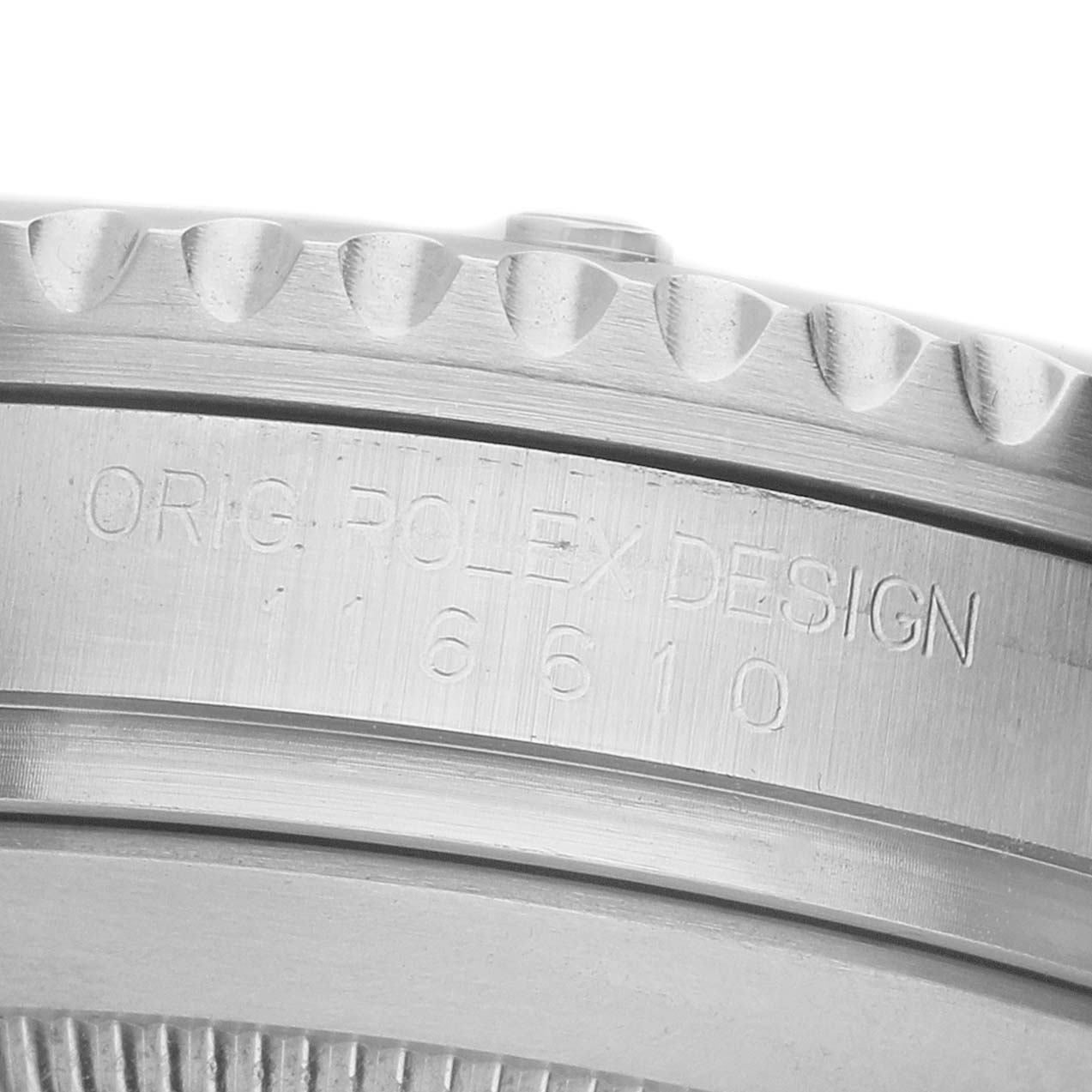 The image shows a close-up of the engraved side of a Rolex Submariner 116610LV Men's Stainless Steel Green Dial's case, featuring the model number.