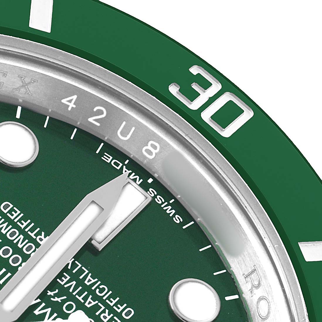 The image shows a close-up of the Rolex Submariner 116610LV Men's Stainless Steel Green Dial's dial and bezel, highlighting the 30-minute mark, indices, and text details.