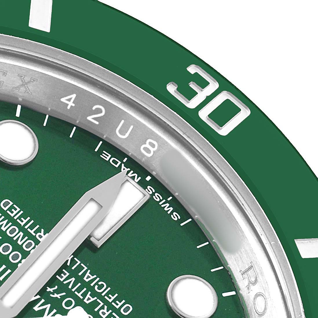 The image shows a close-up of the Rolex Submariner 116610LV Men's Stainless Steel Green Dial's green bezel, part of the dial, and an hour hand.