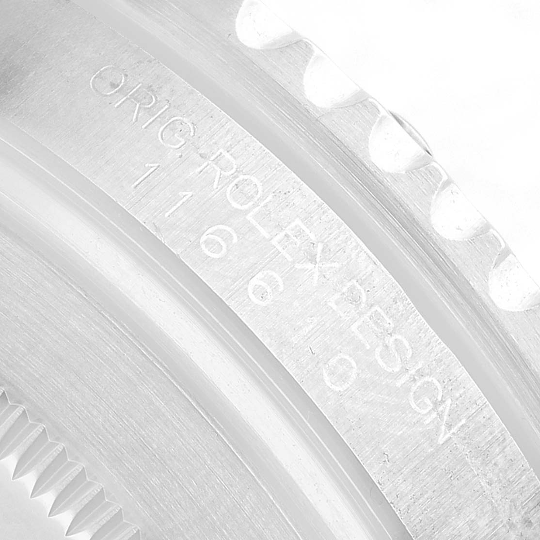 The image shows a close-up of the Rolex Submariner 116610LV Men's Stainless Steel Green Dial's case side, highlighting the engraved text.