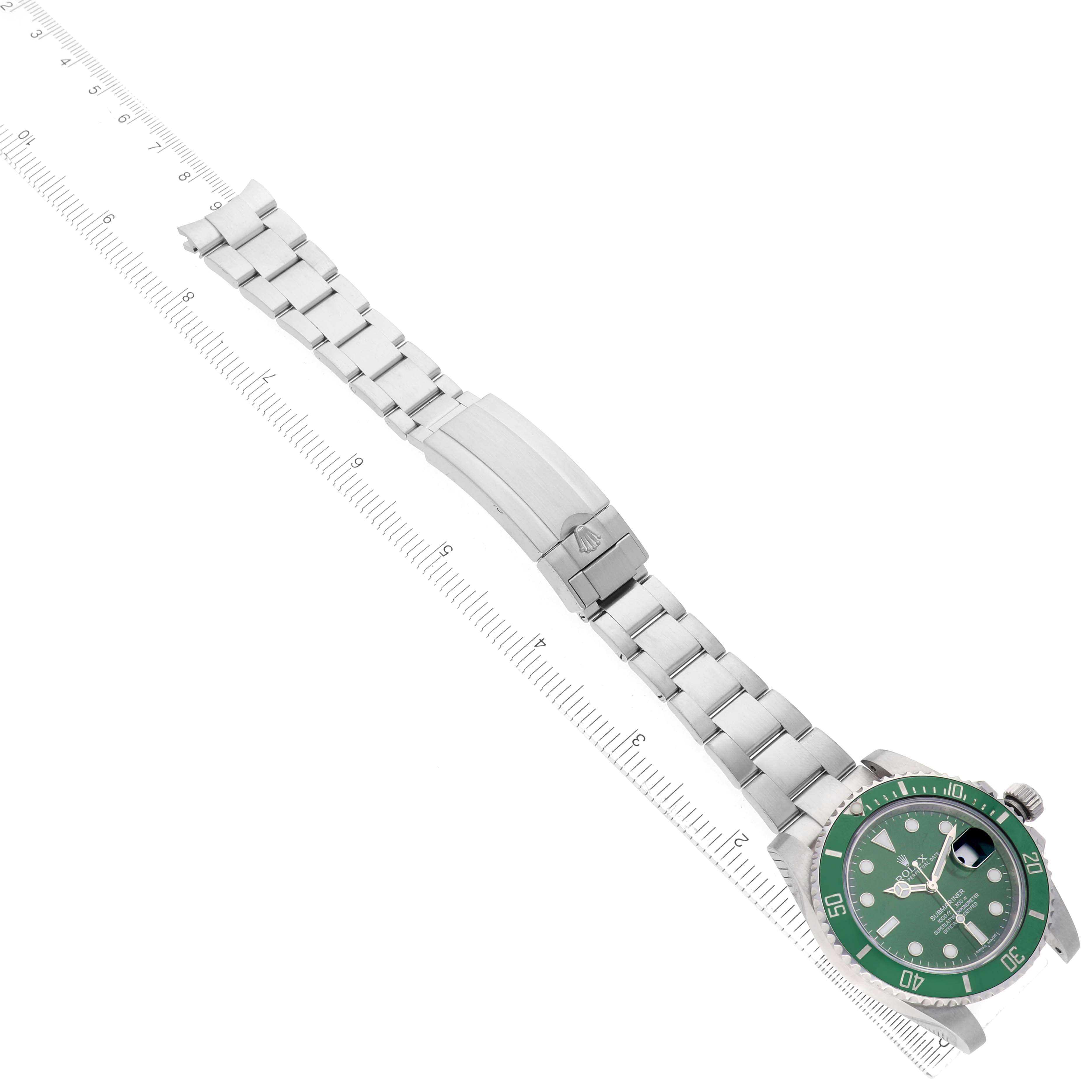 The image shows a side view of the Rolex Submariner 116610LV Men's Stainless Steel Green Dial, featuring the watch face, bezel, and bracelet alongside a ruler.