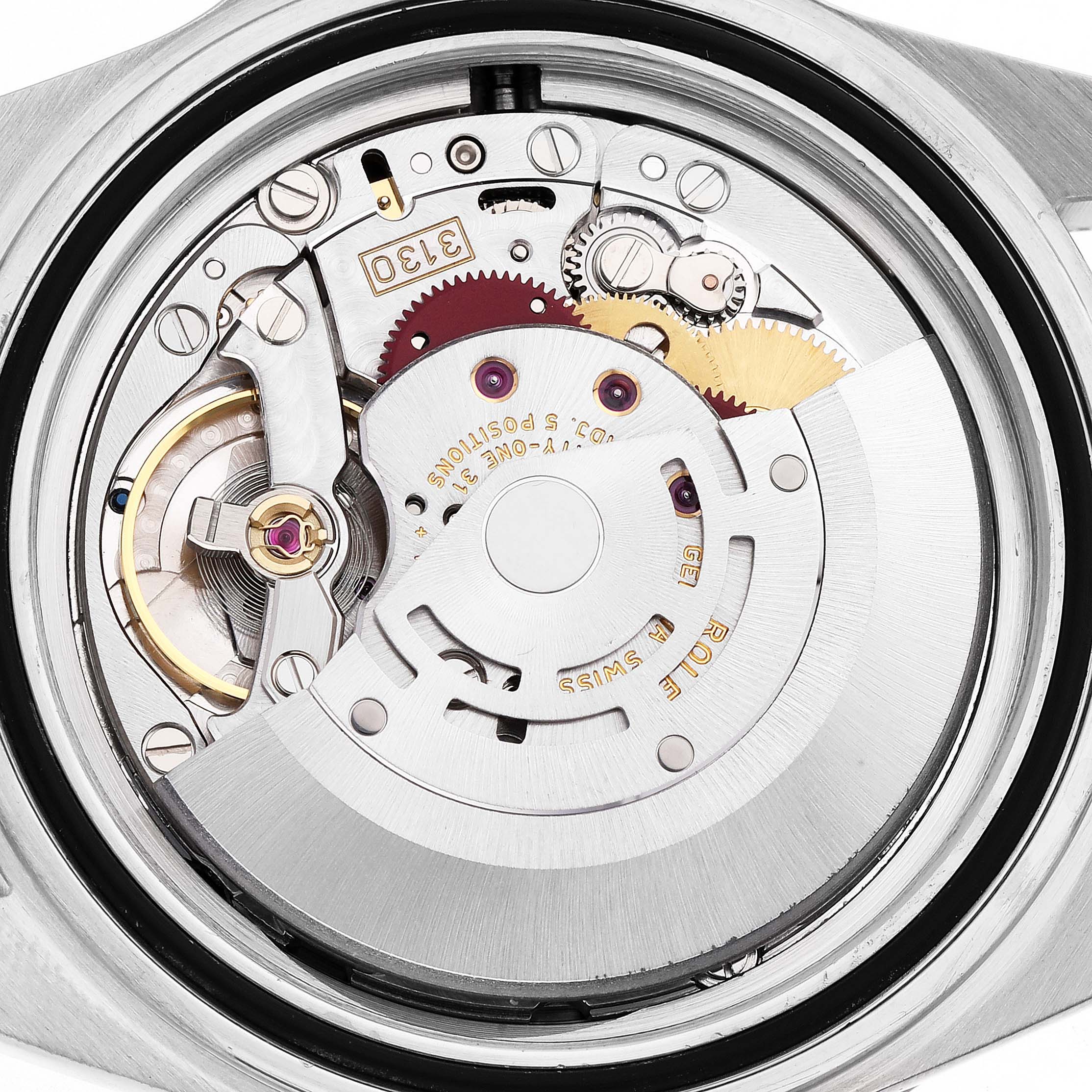 The image shows the movement of a Rolex Submariner 14060 Men's Stainless Steel Black Dial watch from a back angle, highlighting gears and components.