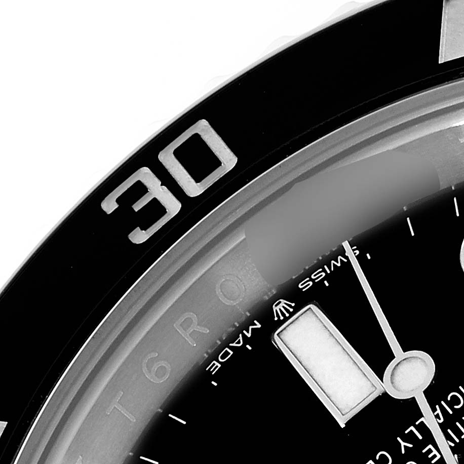 This close-up image shows the bezel, dial, and minute hand of a Rolex Submariner 124060 Men
s Stainless Steel Black Dial 124060 Men
s Stainless Steel Black Dial watch, focusing on the "30" bezel marker.