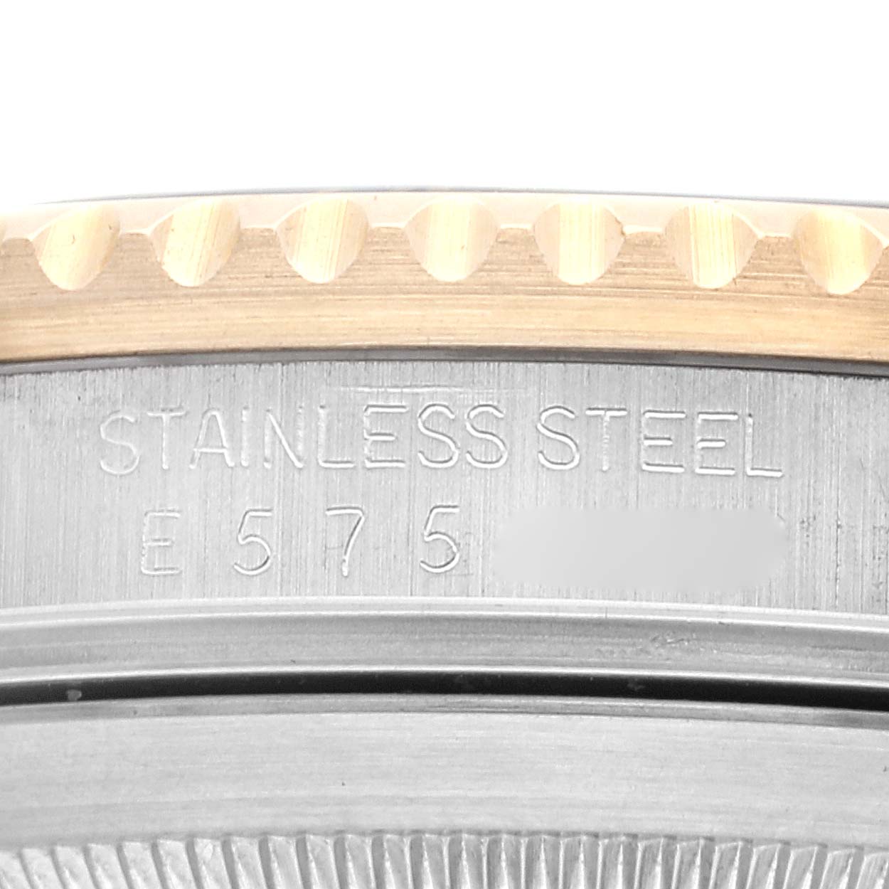 This close-up image shows part of the case back and the stainless steel serial engraving of a Rolex Submariner 16613 Men
s Stainless Steel Black Dial 16613 Men
s Stainless Steel Black Dial watch.