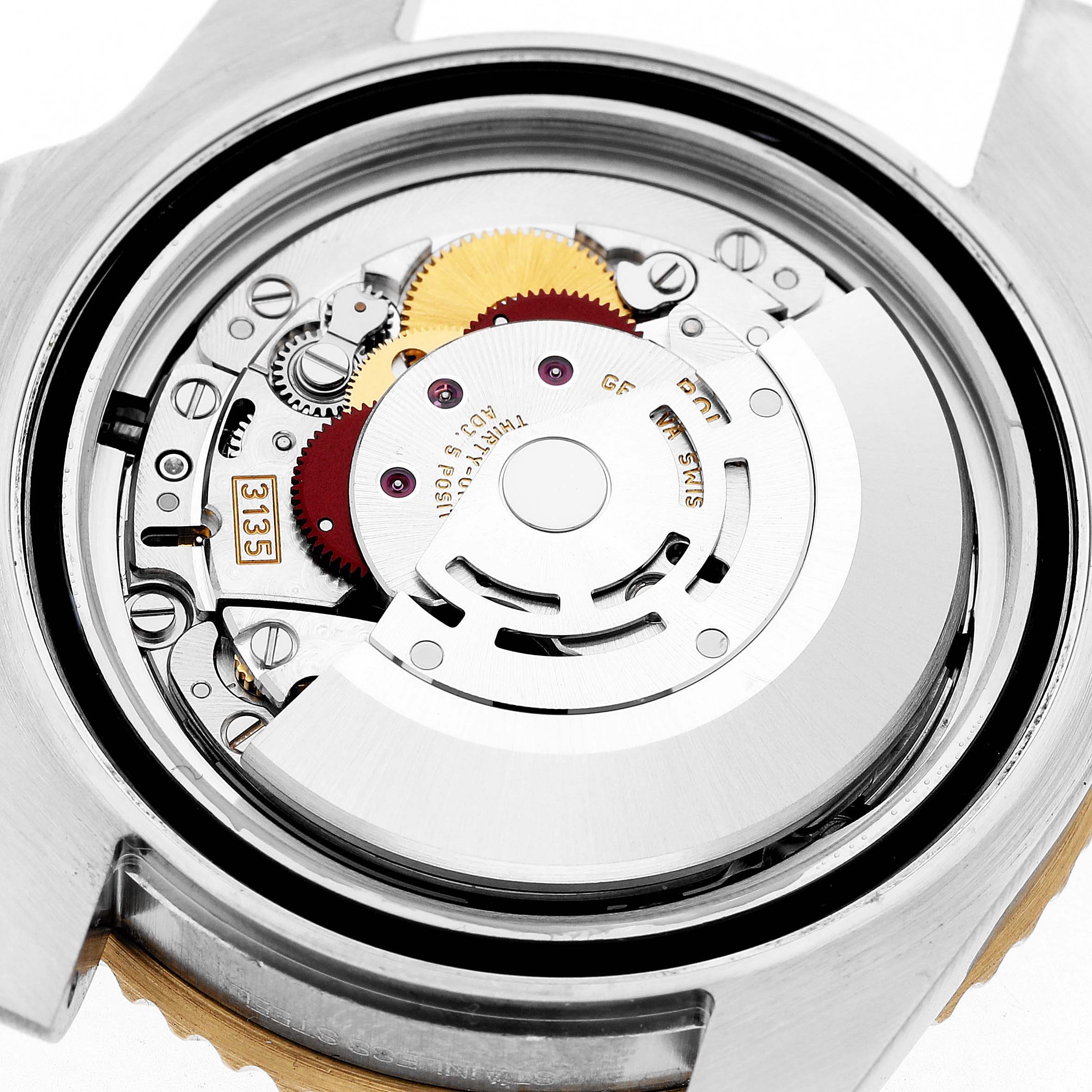 The image shows the internal mechanism of a Rolex Submariner 116613 Men's Steel and Gold (two tone) Black Dial watch, featuring gears and the rotor from a close-up top angle.