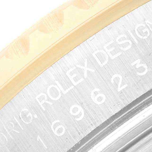 This image shows a close-up view of the bezel and case edge with engraved text of a Rolex Yacht-Master 169623 Women's Steel and Gold (two tone) Champagne Dial 169623 Women's Steel and Gold (two tone) Champagne Dial watch.