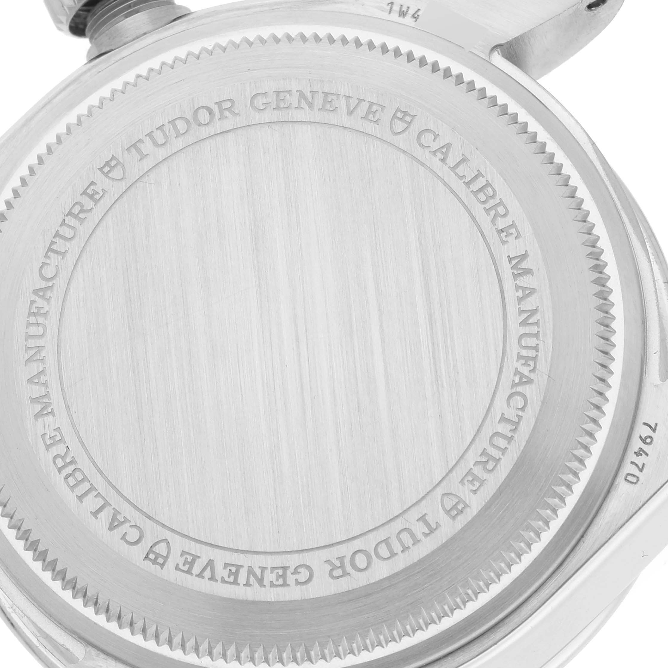 The image shows the back case of a Tudor Heritage Black Bay M79470 Men
s Stainless Steel Black Dial M79470 Men
s Stainless Steel Black Dial watch, displaying engravings and the brushed metal finish.