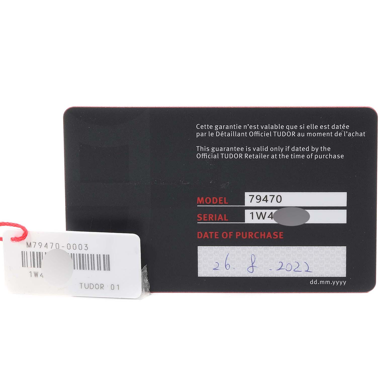 This image shows the warranty card for a Tudor Heritage Black Bay M79470 Men
s Stainless Steel Black Dial M79470 Men
s Stainless Steel Black Dial watch, displaying the model and serial numbers and date of purchase.