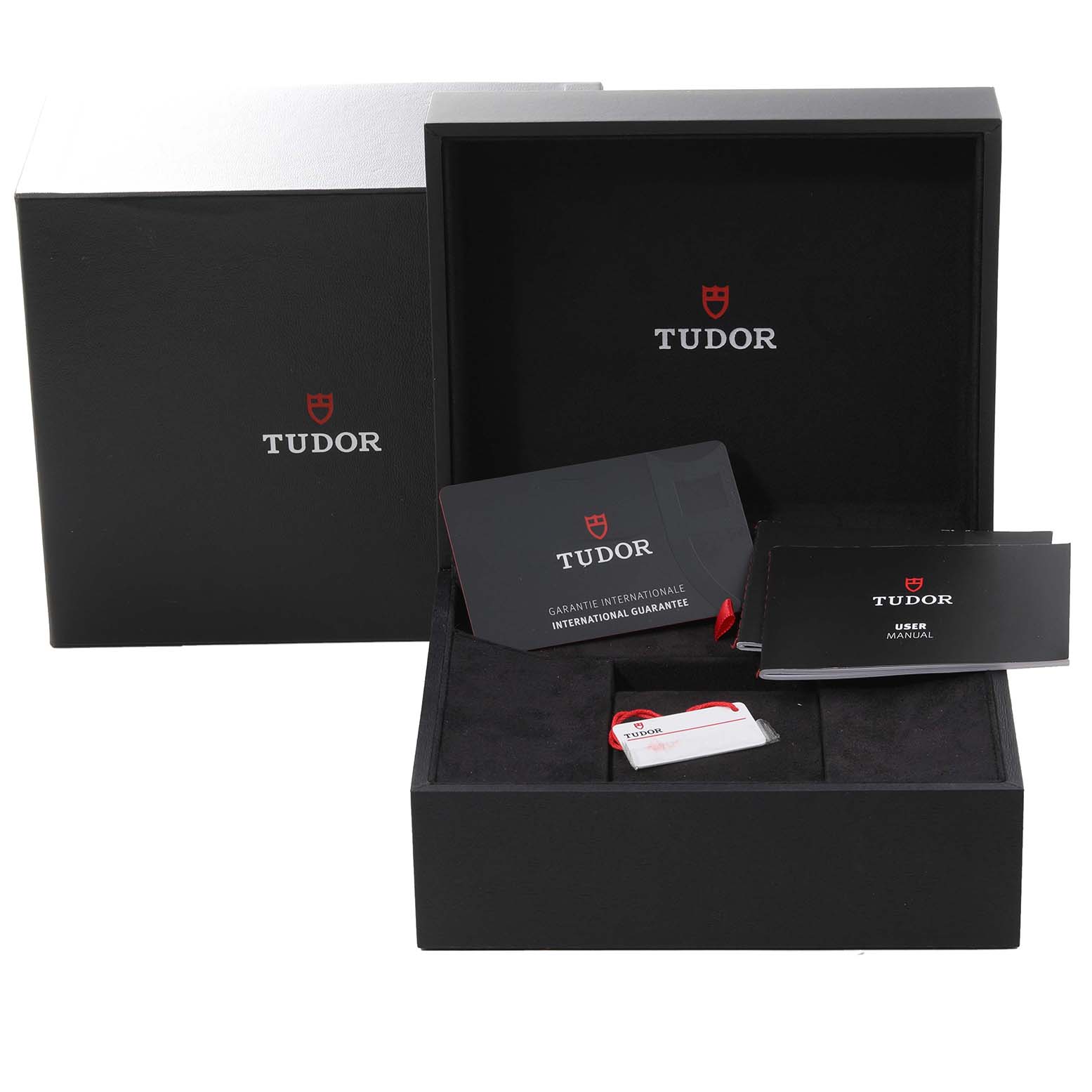 The image shows the packaging, guarantee card, user manual, and tag for a Tudor Heritage Black Bay M79470 Men
s Stainless Steel Black Dial M79470 Men
s Stainless Steel Black Dial watch.