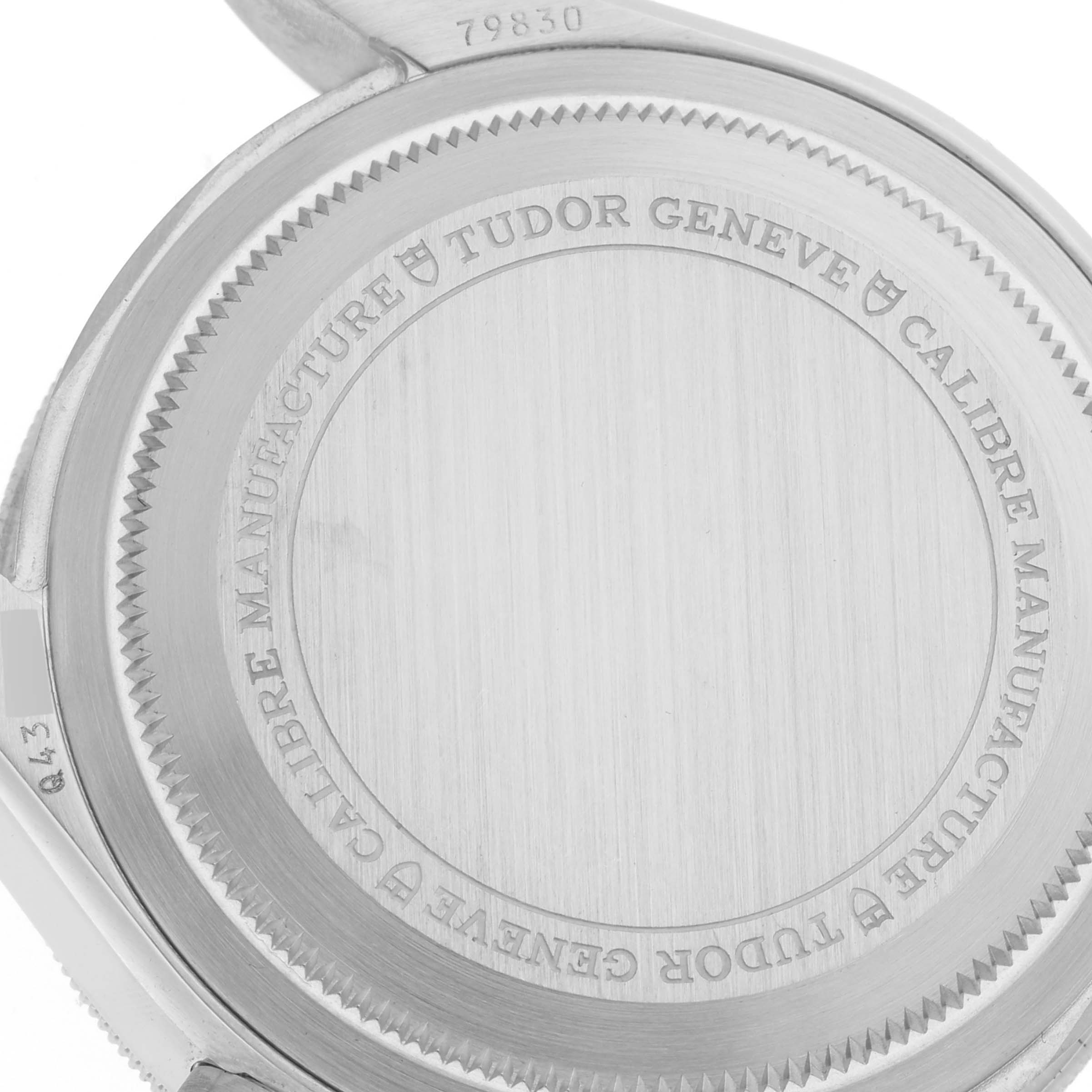 The image shows the case back of the Tudor Heritage Black Bay 79830RB Men
s Stainless Steel Black Dial 79830RB Men
s Stainless Steel Black Dial watch, displaying engraved text and the reference number.