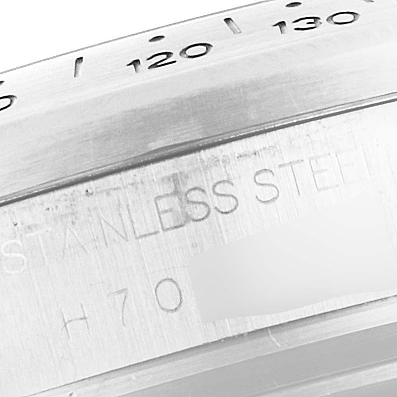 This close-up image showcases the stainless steel bezel of the Tudor Sport Chronograph 20300 Men's Stainless Steel Silver Dial 20300 Men's Stainless Steel Silver Dial, displaying part of the tachymeter scale.