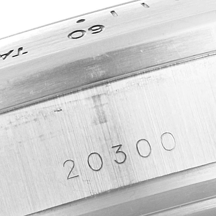The image shows a close-up of the case back and part of the bezel of a Tudor Sport Chronograph 20300 Men's Stainless Steel Silver Dial 20300 Men's Stainless Steel Silver Dial watch, highlighting the engraving.